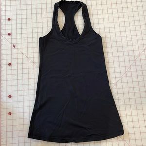 Lululemon black top with ruffled neck